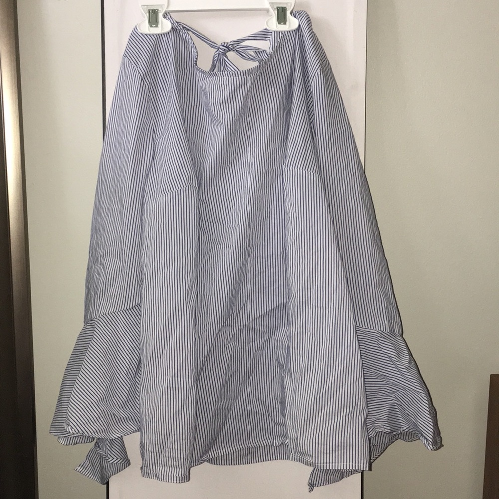 White and blue striped shirt.